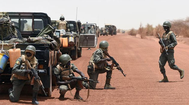 Malian soldiers secure a road between Goundam and Timbuktu, northern Mali, on June 2, 2015, during a joint operation "La Madine 3"/FILE