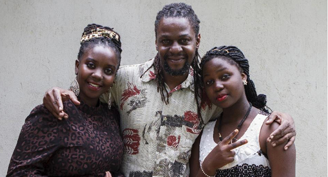 Newzbeat's host Sharon Bwogi AKA Lady Slyke (L), writer and producter Daniel Kisekka aka "Survivor" (C) and rapper Zoe Kabuye/AFP