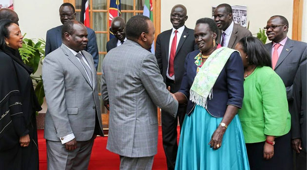 President Kenyatta shakes hands with Rebecca Garang and other SSudan leaders. Photo/ PSCU