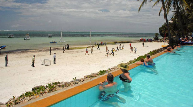 Tourists enjoy the sun and sands at the Voyager Beach Resort, Mombasa.