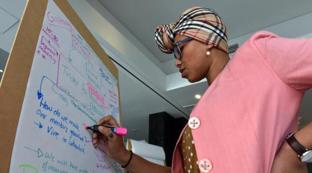 Yassmin Abdel-Magied works on a team project to find ways to combat the Islamic State group's online propaganda machine, in Sydney, on June 11, 2015/AFP 