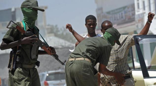 Somali soldiers conduct random checks during a patrol in Mogadishu in February 2015, as part of an operation against Al-Shebab insurgents/AFP