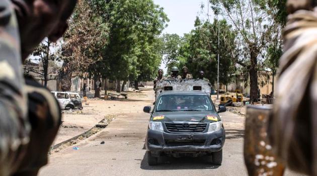 Troops patrol in the city of Bama, northeast Nigeria, on March 25, 2015/AFP