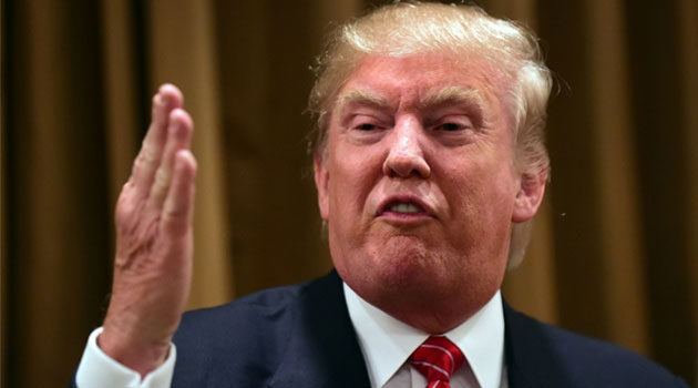 Donald Trump holds at a press briefing where he introduced people whose family members have been killed by illegal immigrants, at the Beverly Wilshire Hotel in Beverly Hills, California on July 10, 2014 © AFP