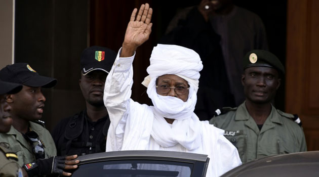 Former Chadian dictator Hissene Habre gestures as he leaves a Dakar courthouse after a hearing on June 3, 2015/AFP