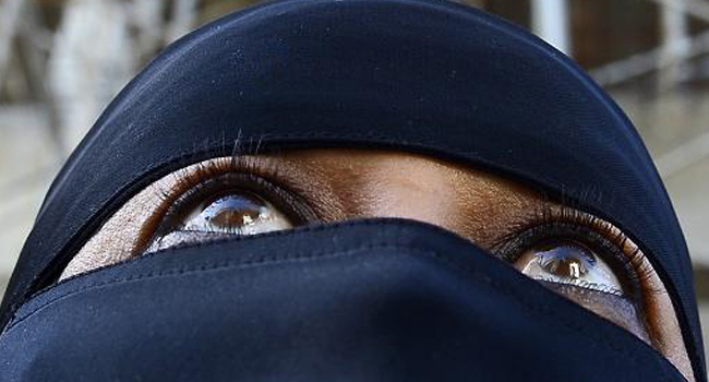 A woman wearing a full hijab/FILE