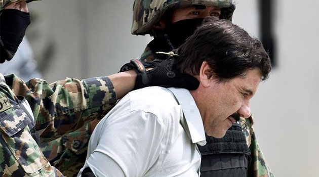 Mexican drug lord Joaquin "El Chapo" Guzman -- pictured after his original recapture on February 22, 2014 -- has escaped from a maximum-security prison outside Mexico City, his second jail break in 14 years  © AFP