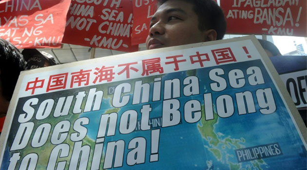 Protesters rally outside the Chinese Consulate in Manila on July 7, 2015, denouncing China's claim to most of the South China Sea including areas claimed by the Philippines © AFP