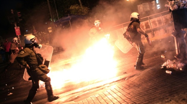 Greek Prime Minister Alexis Tsipras managed to push through a series of unpopular reforms demanded by the country's international creditors, while on the streets of Athens anti-austerity protesters threw firebombs at police/AFP  