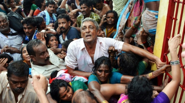 Indian devotees gather after a stampede at a religious festival in Godavari in the Rajahmundry district on July 14, 2015/AFP  