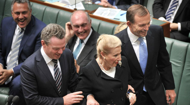 The entitlements row kicked off when it emerged that then speaker Bronwyn Bishop, centre, with Prime Minister Tony Abbott, right, had taken a helicopter, at a cost of $5,000, to fly to a Liberal Party function instead of taking a one-hour car journey/AFP