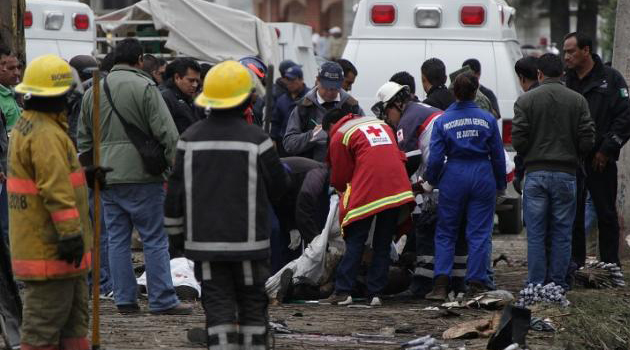 Rescue workers at a blast site in China/FILE