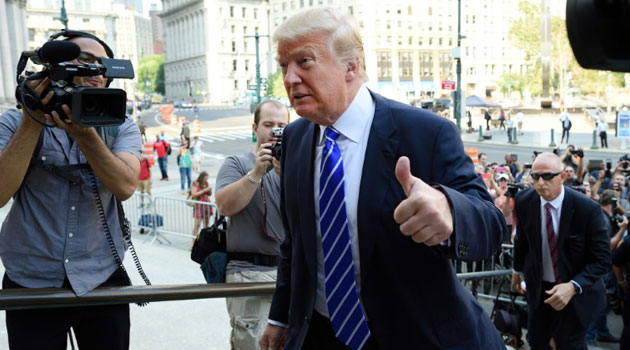 Donald Trump arrives for jury duty at New York Supreme Court in New York City on August 17, 2015/AFP