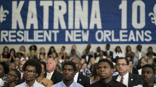 People listen to US President Barack Obama during a roundtable discussion at the Andrew P. Sanchez Community Center on August 27, 2015 in New Orleans, Louisiana/AFP