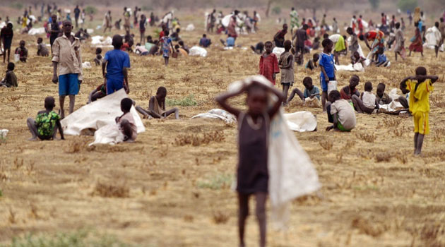 Children flock to a field demarcated for food-drops at a village in Nyal, South Sudan, on February 24, 2015/AFP-File Tony Karumba
