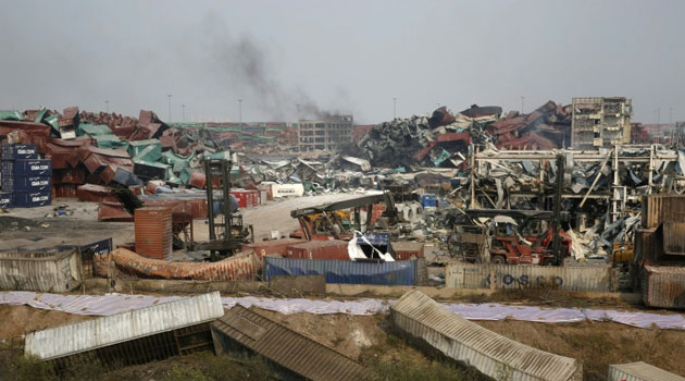 Damaged shipping containers pictured on August 17, 2015 at the site of the explosions last week that hit a chemical warehouse in Tianjin/AFP