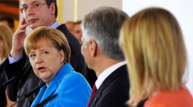 German Chancellor Angela Merkel, attending the Western Balkans Summit in Vienna on August 27, 2015, said it was a "dark day" as the tragedy in Austria unfolded/AFP 