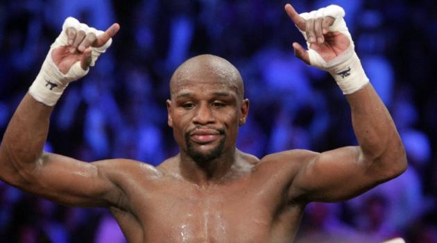 Floyd Mayweather celebrates after defeating Manny Pacquiao in their welterweight unification bout on May 2, 2015 at the MGM Grand Garden Arena in Las Vegas, Nevada/AFP