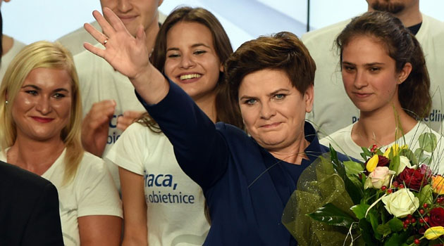 Beata Szydlo, candidate for prime minister of the conservative opposition Law and Justice (PiS) celebrates with supporters at the party's headquarters in Warsaw after exit poll results were announced on October 25, 2015 © AFP