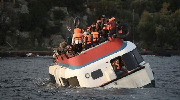 Migrants call for help as their boat sinks off the Greek island of Lesbos on October 30, 2015/AFP