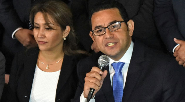 President-elect Jimmy Morales, of the National Front Convergence, delivers a speech next to his wife Hilda Marroquin, after winning the run-off election, in Guatemala City on October 25, 2015  © AFP 