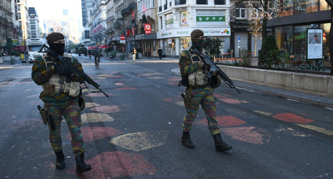 Belgian troops patrol a street in Brussels/AFP