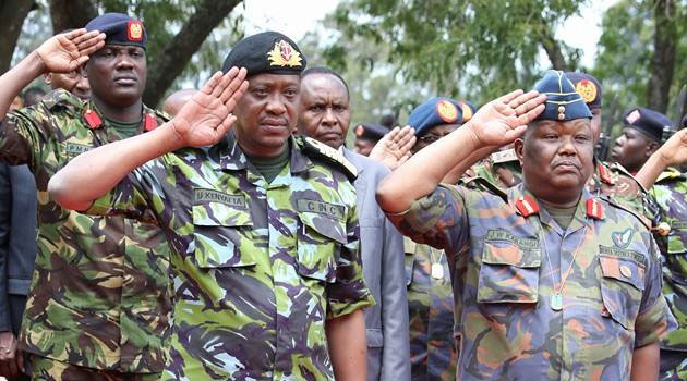 President Kenyatta with former Military chief Julius Karangi who commanded the troops to Somalia. Photo/FILE.