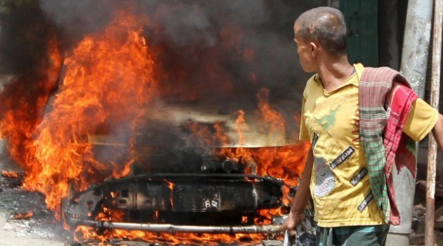 A man looking at a burning object/FILE