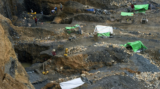 Landslides are a common hazard in Hpakant, Myanmar's Kachin State, as people pick their way across perilous mounds of mine waste, driven by the hope they might find a chunk of jade worth thousands of dollars/AFP