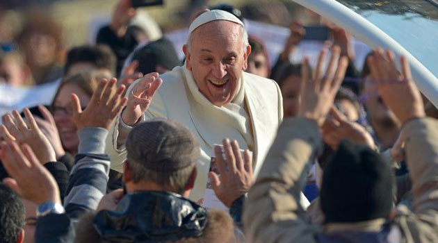 Pope Francis greets faithful/FILE