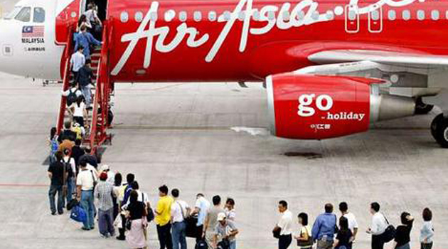 Passengers boarding Air Asia plane/FILE