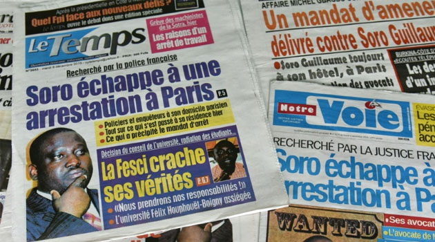 Ivory Coast newspapers in Abidjan run headline news on the arrest warrant issued by a French judge against parliamentary speaker, Guillaume Soro on December 8, 2015 © AFP/File