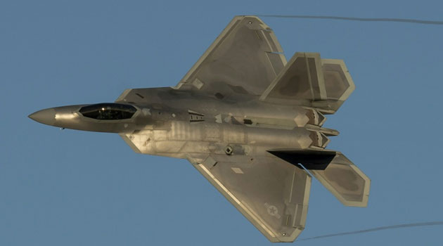 A US Air Force F-22 Raptor stealth fighter performs a demonstration flight during the inaugural Trilateral Exercise with Britain's Royal Air Force and the French Air Force in Hampton, Virginia/AFP