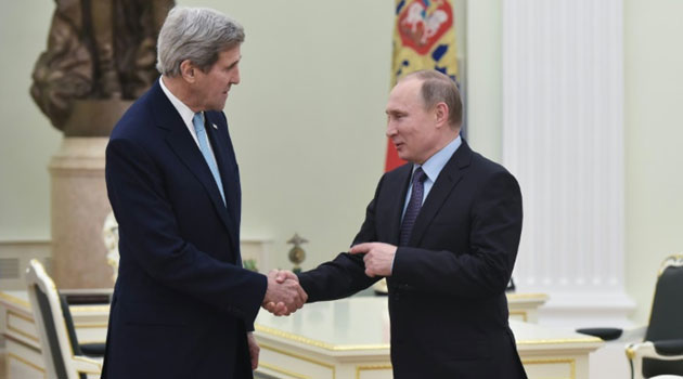 US Secretary of State John Kerry (L) shakes hands with Russia's President Vladimir Putin during a meeting at the Kremlin in Moscow on December 15, 2015/FILE