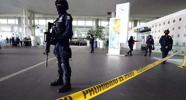 Police manning an airport in Mexico/AFP