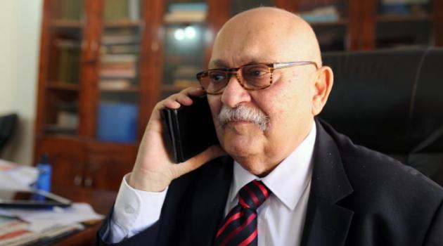 Human rights lawyer Nabil Adib speaks on the phone at his office during an interview with AFP on December 22, 2015 in the Sudanese capital Khartoum/AFP