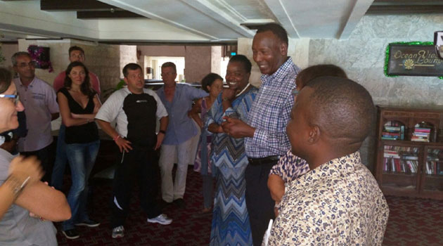 Nkaissery speaks to passengers who were booked into a hotel after the scare. Others were being interrogated/CFM NEWS