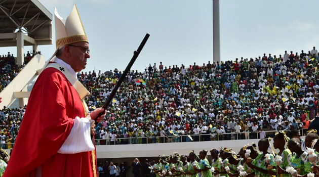 Pope Francis celebrates an open Mass at Bangui Stadium in the capital of the Central African Republic on November 30, 2015/AFP