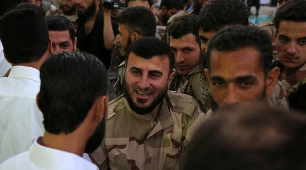 Zahran Alloush (C) was arrested in 2009 and was released in June 2011 in a general amnesty, just three months after Syria's uprising against President Bashar al-Assad erupted  © AFP