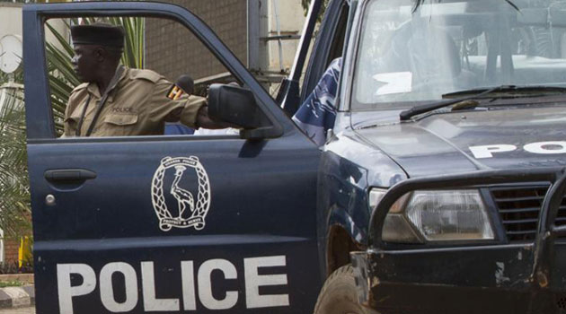 Uganda policeman alighting from a vehicle/FILE