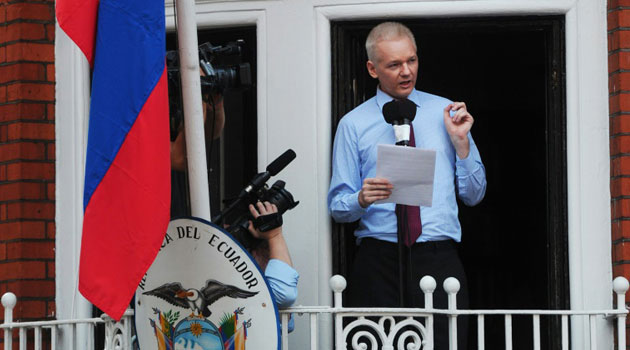 Wikileaks founder Julian Assange addressing the media and his supporters from the balcony of the Ecuadorian Embassy in London in 2012/AFP
