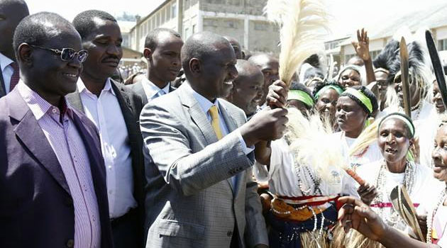 Meru Senator Kiraitu Murungi (l), Governor Peter Munya (c) accompany DP Ruto as he is welcomed with dance to Nkubu. Photo/ PSCU