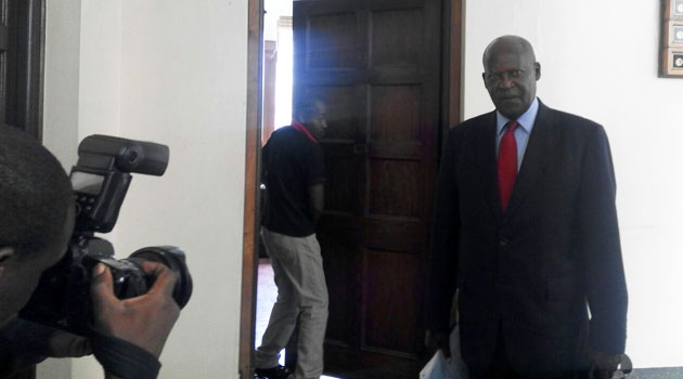 Justice Philip Tunoi walks into the hearing chamber at the Supreme Court buildings. 