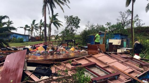  A family digs through the remains of their home in the town of Ba, after it was destroyed by severe tropical cyclone Winston, the only category five storm system to ever hit Fiji, on February 21, 2016/AFP