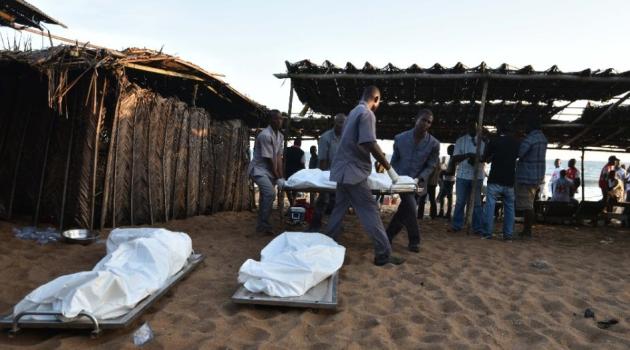 People carry a body on a stretcher after gunmen went on a shooting rampage in the Ivory Coast resort of Grand-Bassam/AFP 