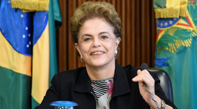 Brazilian President Dilma Rousseff gestures during a meeting with rectors of public universities and technical education at Planalto Palace in Brasilia, on March 11, 2016/AFP