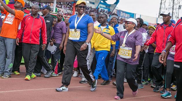 First Lady Margaret with her Rwandan counterpart Jeanette Kagame cross the finish line. Photo/ PSCU