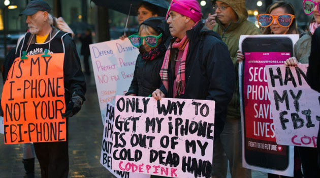 Protesters demonstrate outside the Federal Bureau of Investigation headquarters building in Washington, DC, in February 2016/AFP