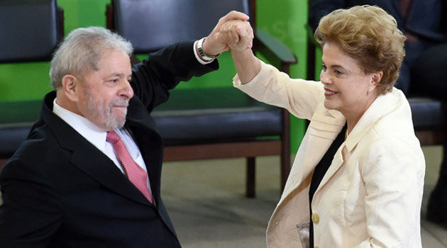 Former president Luiz Inacio Lula da Silva (L) and President Dilma Rousseff have between them governed Brazil for the past 13 years/AFP