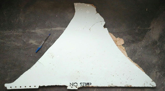 A suspected piece of aircraft debris found on the coast of Mozambique, with Malaysia's transport minister saying there was a "high possibility" it came from a Boeing 777, the same model as missing flight MH370 © ATSB/AFP